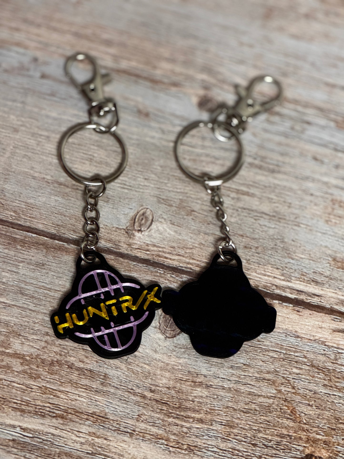 HUNTRX Acrylic Keychain – Purple & Gold Logo with Holographic Back